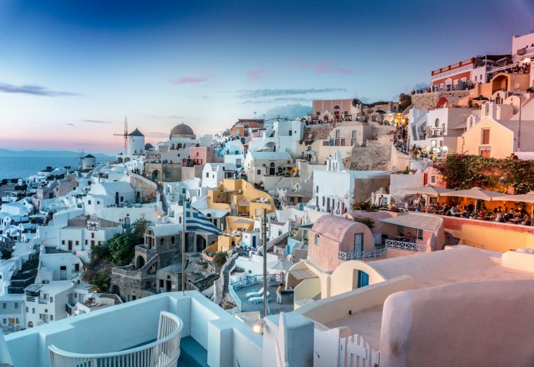 White houses and blue domes of Santorini overlooking the Aegean Sea
