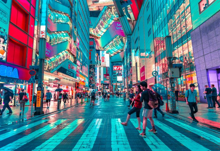 Tokyo city streets lit with neon signs at night