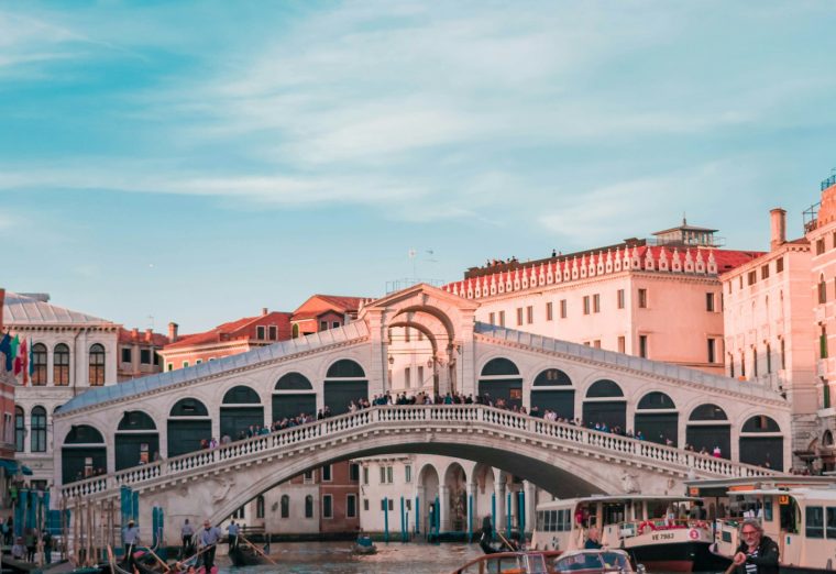Gondolas on a canal in Venice lined with historic buildings